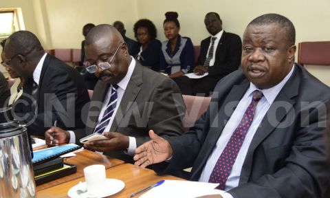 Minister for Justice Kahinda Otafiire(R) and deputy attorney general, Mwesigwa Rukutana appearing before the legal and parliamentary affairs committee on April 11, 2017. 